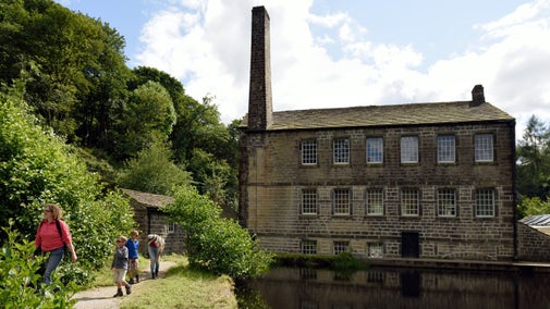 A family walking near Gibson Mill at Hardcastle Crags, West Yorkshire